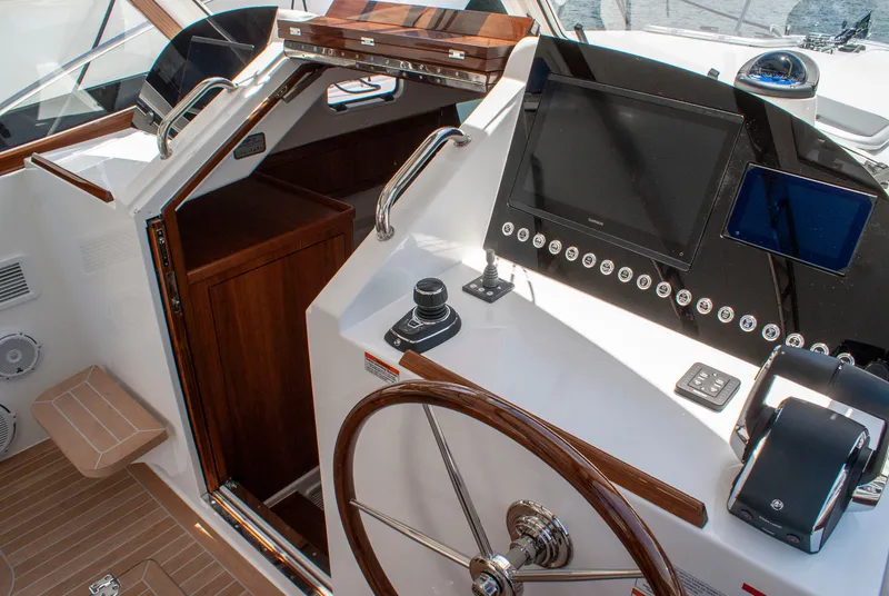 Slide: The Image of Helm of the 2027 MJM Yachts 38R with wooden wheel and modern instruments. - 31