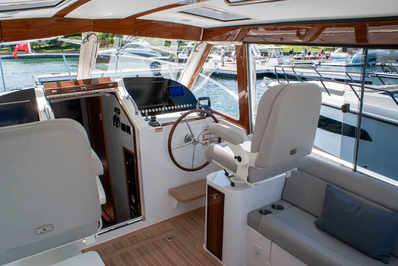 Slide: The Image of The cockpit of the 2027 MJM Yachts 38R features sleek design and modern instruments. - 25
