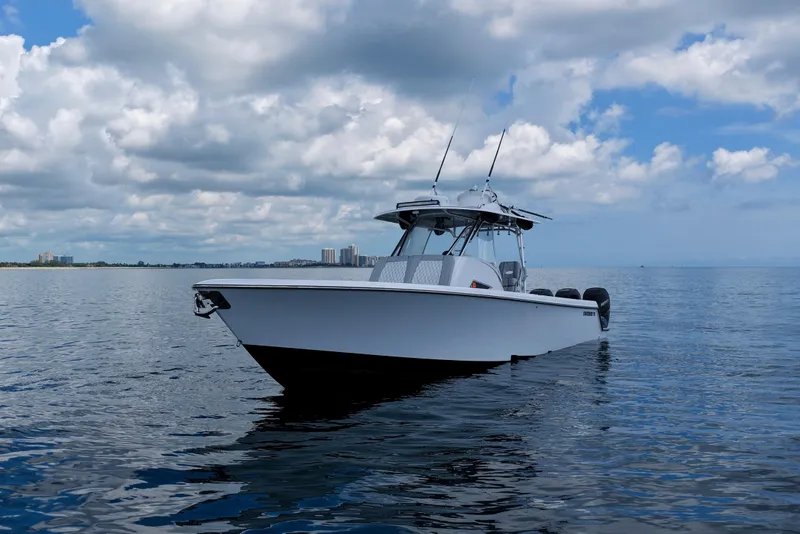 Slide: The Image of 2018 Contender 39 Fisharound boat on calm ocean under cloudy sky. - 11
