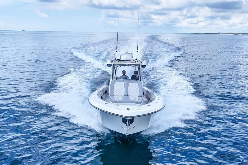 Slide: The Image of 2018 Contender 39 Fisharound cruising on open ocean under cloudy sky. - 3