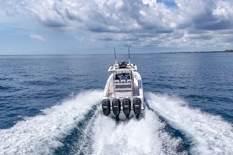Slide: The Image of 2018 Contender 39 Fisharound boat cruising on open ocean with powerful engines. - 4