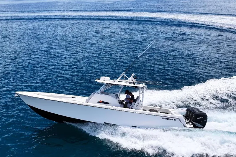 Slide: The Image of 2018 Contender 39 Fisharound boat cruising on open blue ocean waters. - 5