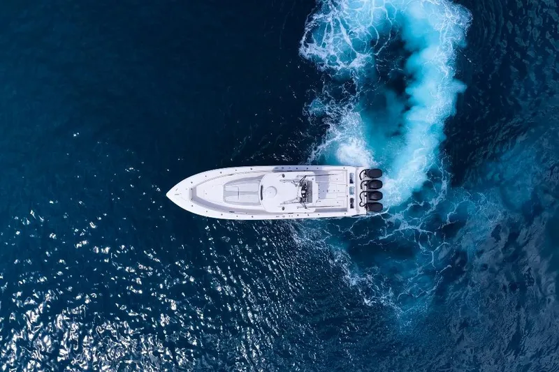 Slide: The Image of Aerial view of 2018 Contender 39 Fisharound boat cruising in deep blue ocean. - 6