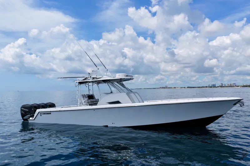 Slide: The Image of 2018 Contender 39 Fisharound boat on calm ocean under blue sky. - 8