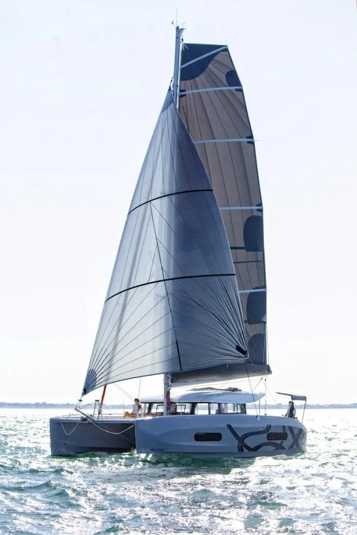 Slide: The Image of Manufacturer Provided Image: Sailing catamaran Excess 11, 2026 model, gliding on open water. - 12
