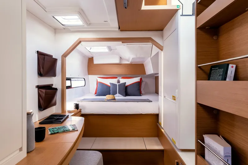 Slide: The Image of Luxurious interior of 2026 Excess 11 yacht, featuring cozy bed and modern wooden design. - 18