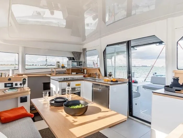 Slide: The Image of Manufacturer Provided Image: Luxurious interior of 2026 Excess 11 catamaran with modern kitchen and ocean view. - 5