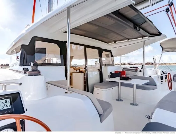 Slide: The Image of Manufacturer Provided Image: Excess 11 catamaran 2026 model, featuring spacious outdoor seating and modern design. - 6