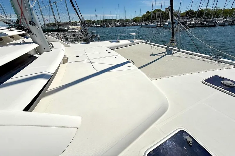 Slide: The Image of Spacious deck of a 2010 Leopard 46 yacht in a marina setting. - 15