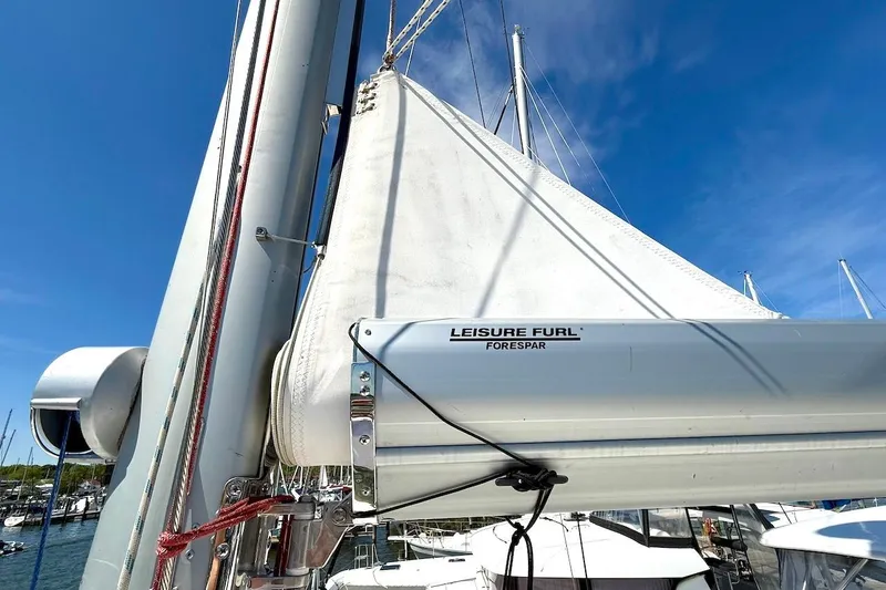 Slide: The Image of Sailboat mast and boom with Leisure Furl system on a 2010 Leopard 46. - 17