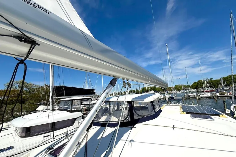 Slide: The Image of Sailing yacht Leopard 46, 2010 model, docked in a marina under clear blue skies. - 18