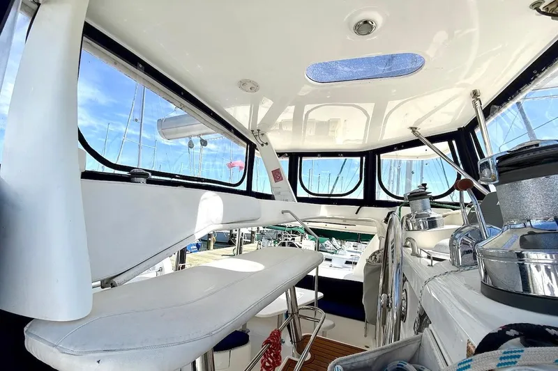 Slide: The Image of Interior view of a 2010 Leopard 46 yacht cockpit with seating and navigation equipment. - 21