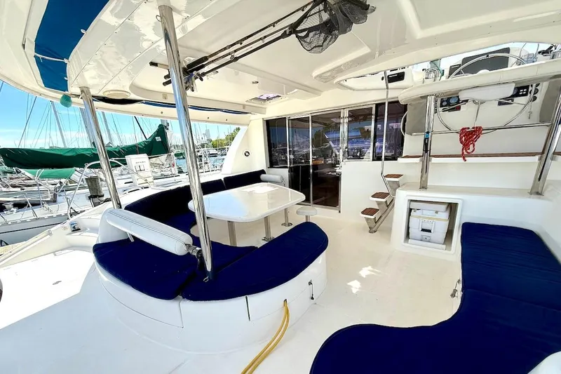 Slide: The Image of Spacious deck of 2010 Leopard 46 yacht with blue seating and dining area. - 36