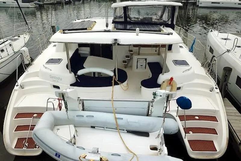 Slide: The Image of Leopard 46 catamaran from 2010 docked at marina with inflatable dinghy. - 5