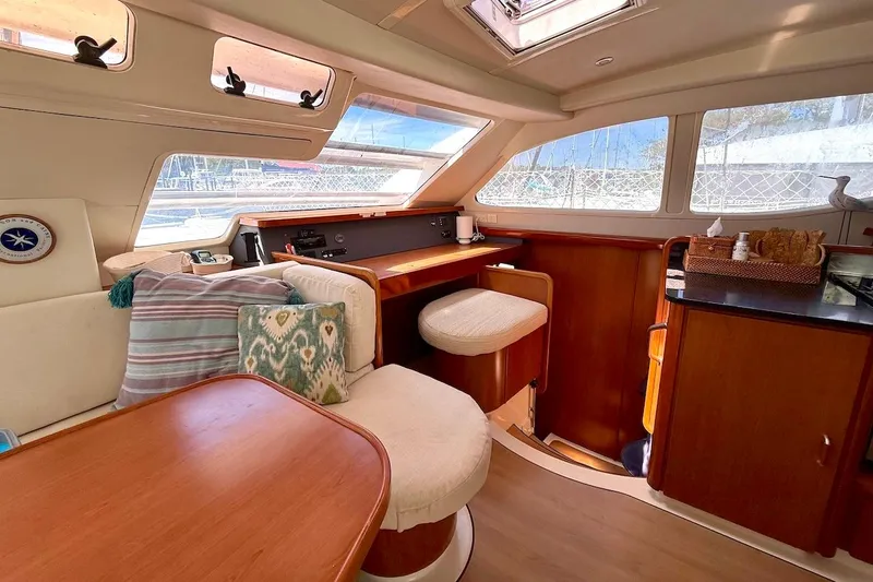 Slide: The Image of Luxurious interior of a 2010 Leopard 46 yacht with elegant wood finishes and plush seating. - 53