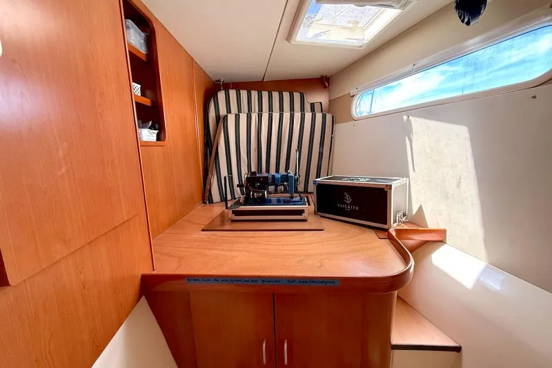 Slide: The Image of Interior of a 2010 Leopard 46 yacht with wooden cabinetry and sewing machine. - 67