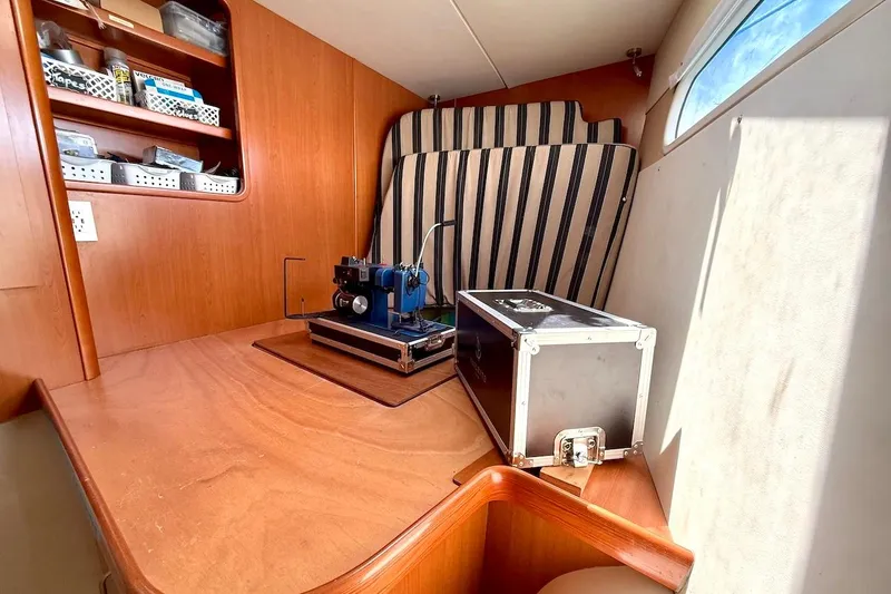 Slide: The Image of Wooden interior of a 2010 Leopard 46 yacht with equipment and storage shelves. - 68