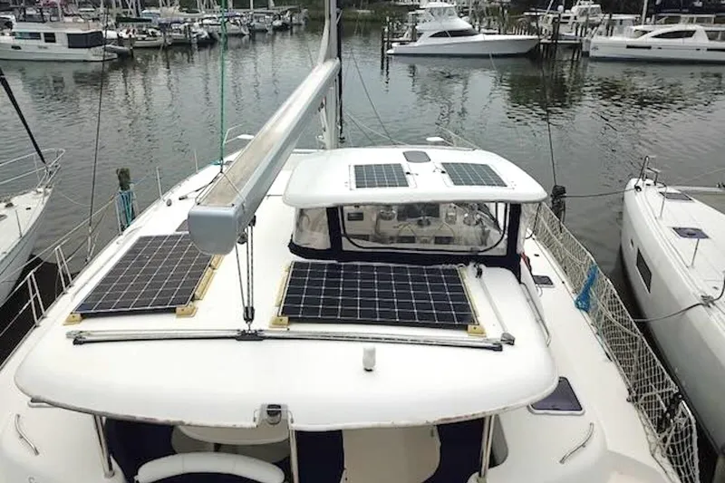Slide: The Image of Leopard 46 catamaran with solar panels docked in a marina, 2010 model. - 7