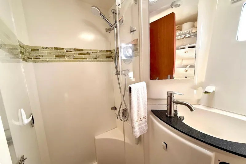 Slide: The Image of Modern bathroom in 2010 Leopard 46 yacht with shower and sleek sink design. - 73