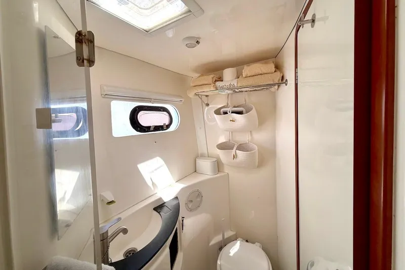 Slide: The Image of Bathroom interior of 2010 Leopard 46 yacht with window, sink, and storage. - 74