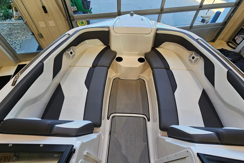 Slide: The Image of 2022 Yamaha Boats SX210 interior with sleek seating and modern design. - 14