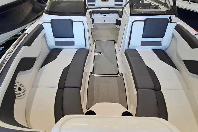 Slide: The Image of 2022 Yamaha Boats SX210 interior with spacious seating and modern design. - 15