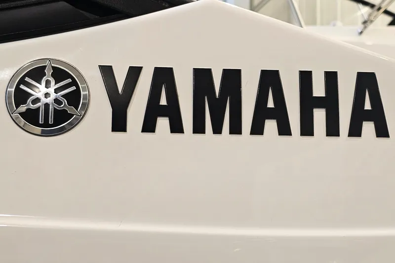 Slide: The Image of 2022 Yamaha Boats SX210 logo on white surface, featuring bold black lettering. - 27