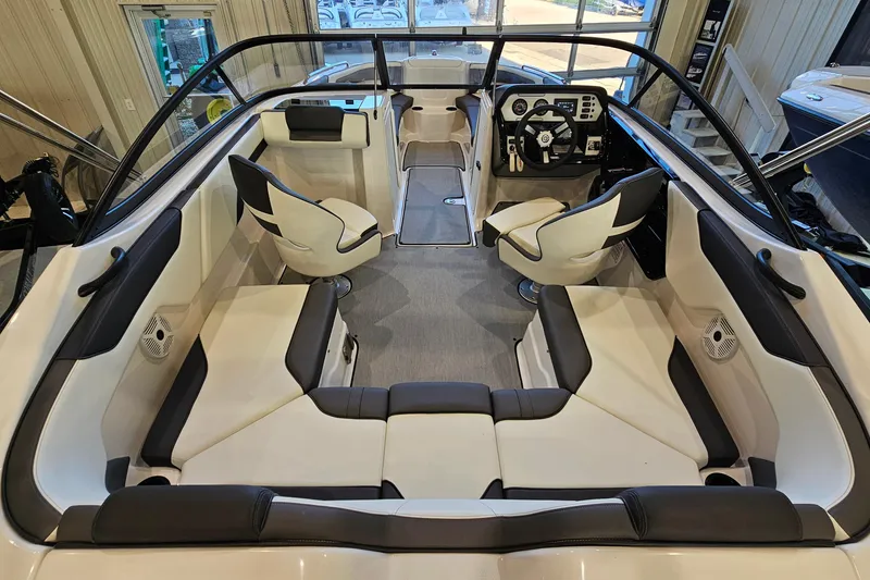 Slide: The Image of 2022 Yamaha Boats SX210 interior with sleek seating and modern dashboard design. - 6