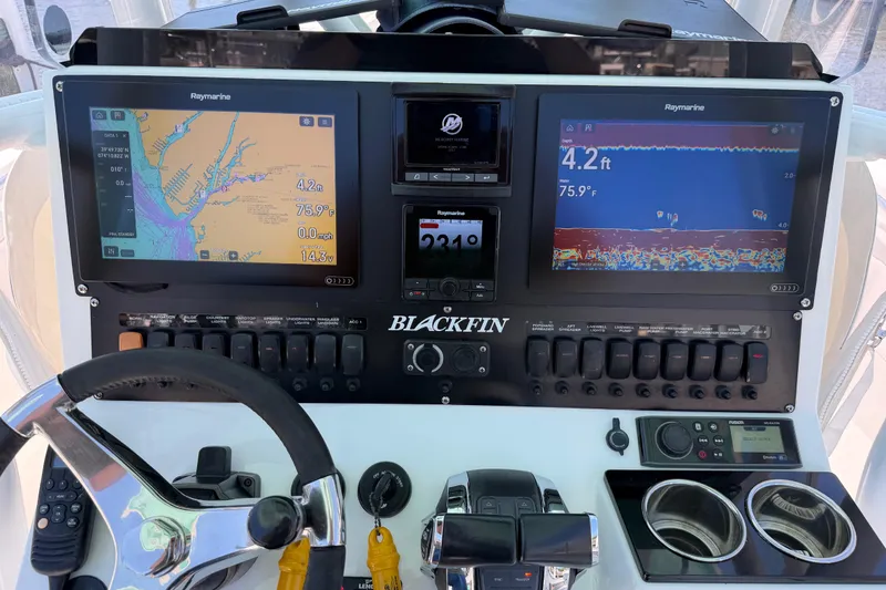 Slide: The Image of 2019 Blackfin 242 CC boat dashboard with navigation and sonar displays. - 17