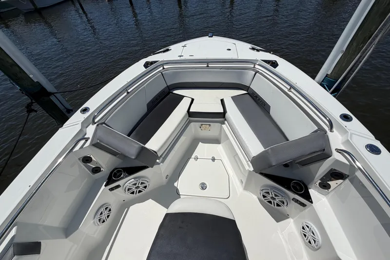 Slide: The Image of 2019 Blackfin 242 CC boat interior with cushioned seating and speakers. - 20
