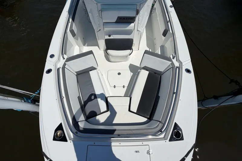 Slide: The Image of 2019 Blackfin 242 CC boat interior with cushioned seating and sleek design. - 25