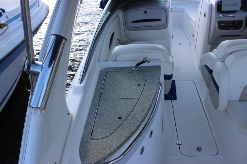 Slide: The Image of 2007 Chaparral 276 SSX boat interior with seating and a built-in sink. - 10