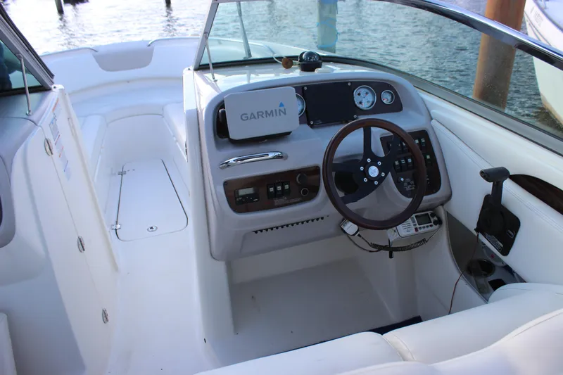 Slide: The Image of 2007 Chaparral 276 SSX boat cockpit with Garmin navigation system and sleek steering wheel. - 11
