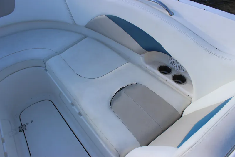 Slide: The Image of Interior seating of a 2007 Chaparral 276 SSX boat with cup holders. - 13