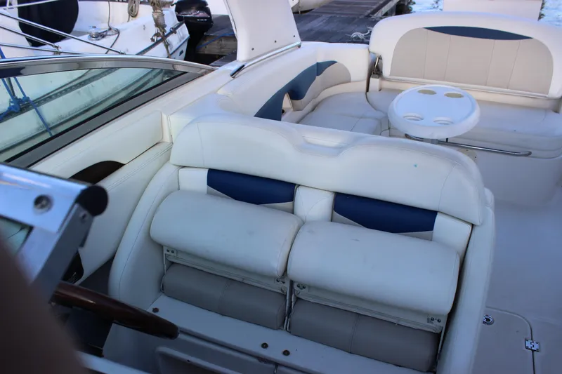 Slide: The Image of Interior of 2007 Chaparral 276 SSX boat with white seating and cup holders. - 17