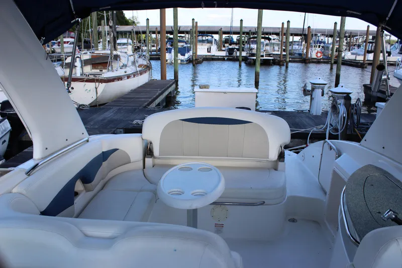 Slide: The Image of 2007 Chaparral 276 SSX boat interior with seating, docked at a marina. - 18