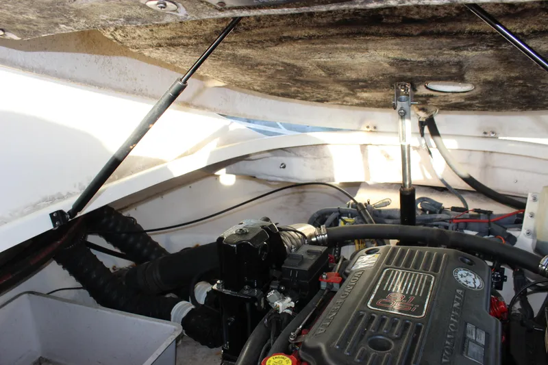 Slide: The Image of Engine compartment of a 2007 Chaparral 276 SSX boat, featuring a Volvo Penta engine. - 25