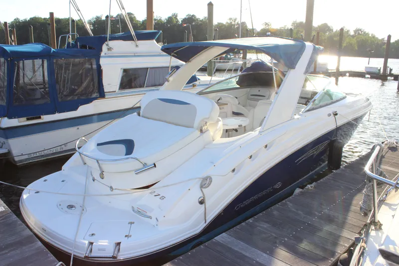 Slide: The Image of 2007 Chaparral 276 SSX boat docked at marina, featuring sleek design and spacious seating. - 27