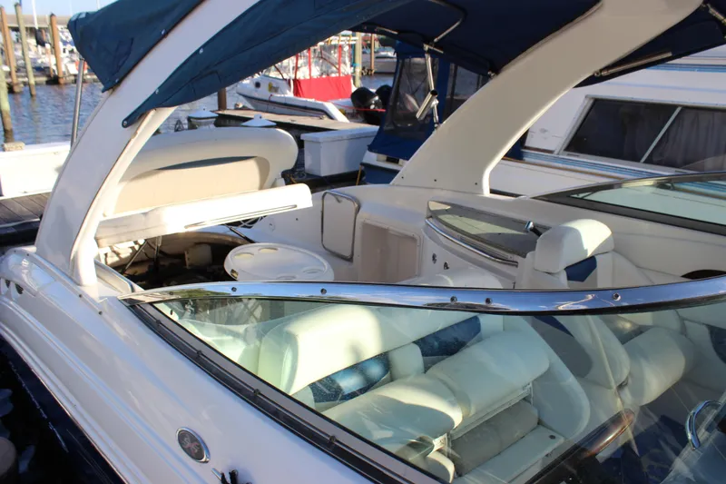 Slide: The Image of 2007 Chaparral 276 SSX boat with blue canopy, docked at marina. - 29