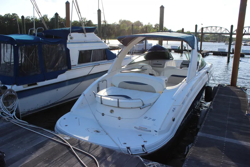 Slide: The Image of 2007 Chaparral 276 SSX boat docked at marina, sunny day, calm water. - 6