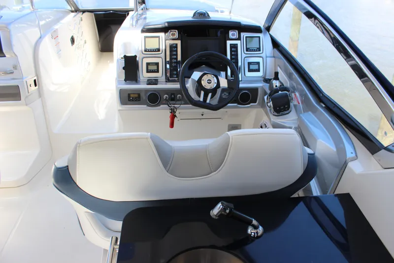 Slide: The Image of Interior cockpit of 2012 Chaparral 327 SSX boat with steering wheel and control panel. - 10