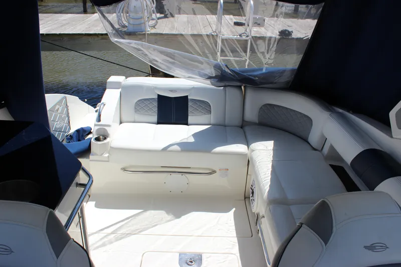 Slide: The Image of Luxurious seating area on a 2012 Chaparral 327 SSX boat, featuring elegant upholstery. - 11