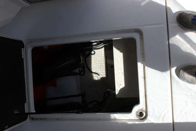 Slide: The Image of Storage compartment on a 2012 Chaparral 327 SSX boat, showing interior details. - 23