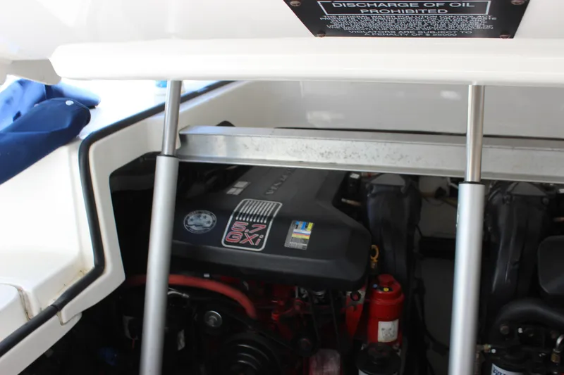 Slide: The Image of Engine compartment of a 2012 Chaparral 327 SSX boat, featuring a 5.7 GXI engine. - 24