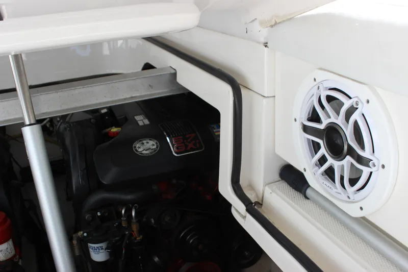 Slide: The Image of Engine compartment of 2012 Chaparral 327 SSX with visible speaker and components. - 25