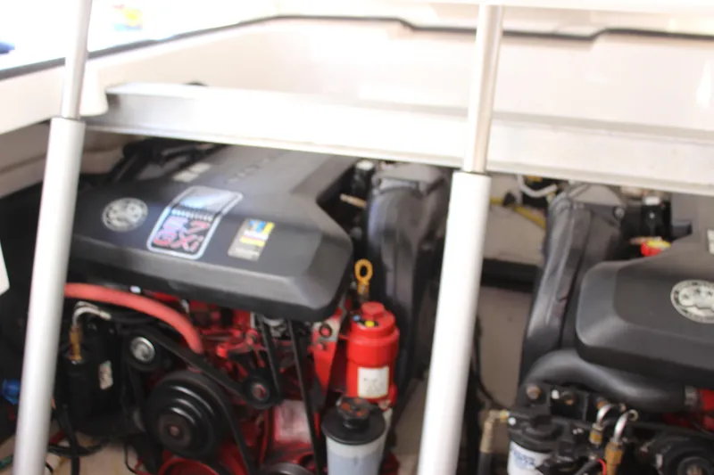 Slide: The Image of Engine compartment of a 2012 Chaparral 327 SSX boat, showcasing dual engines. - 28