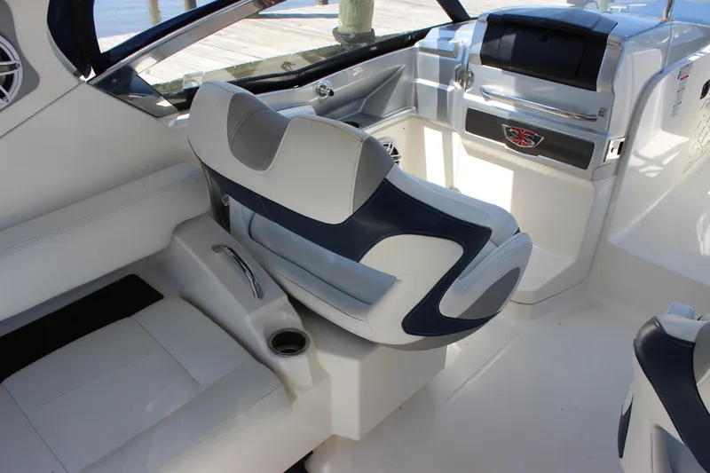 Slide: The Image of Interior of 2012 Chaparral 327 SSX boat with modern seating and dashboard. - 9