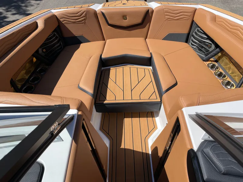 Slide: The Image of 2025 Nautique G23 interior with luxurious leather seating. - 11
