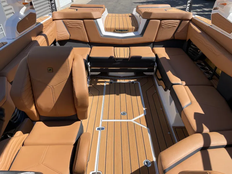Slide: The Image of Interior of 2025 Nautique G23 with luxurious leather seating. - 12