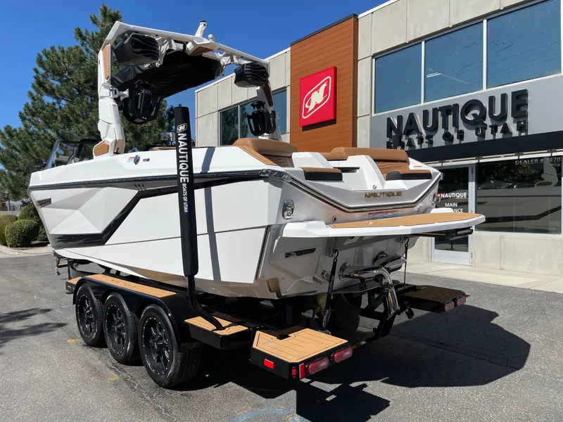 Slide: The Image of 2025 Nautique G23 boat outside a Utah dealership. - 3